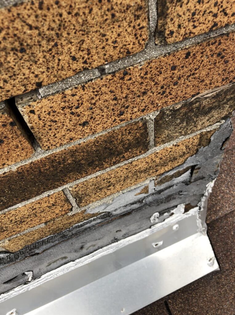 Accurate Roof Management | Inspections | Chimney flashings need to be resealed
